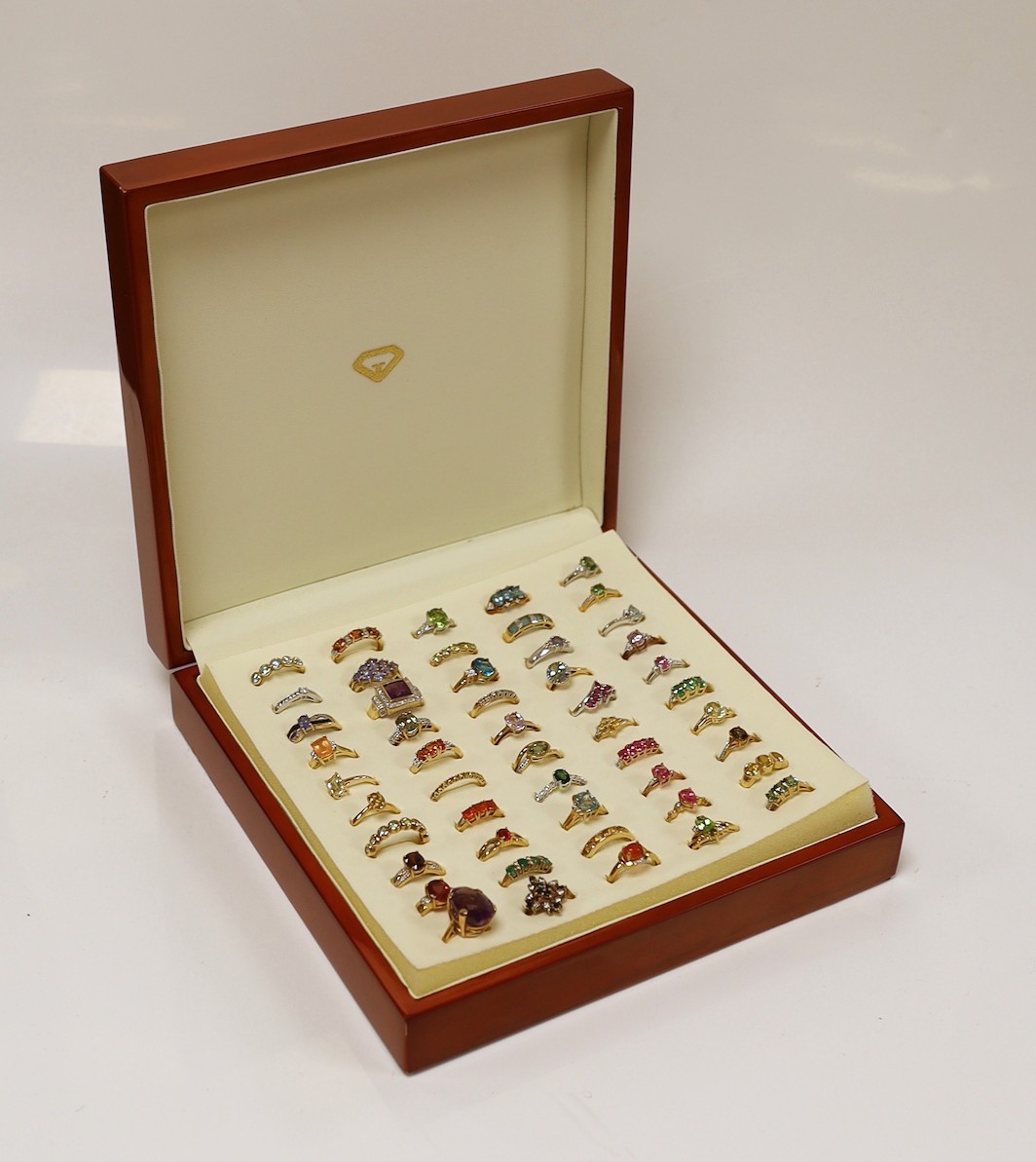 Forty seven assorted modern 9ct gold and gem set dress rings, including amethyst, citrine and garnet, two stamped 10k and one 9k and three 18ct gold and gem set dress rings, in ring box.